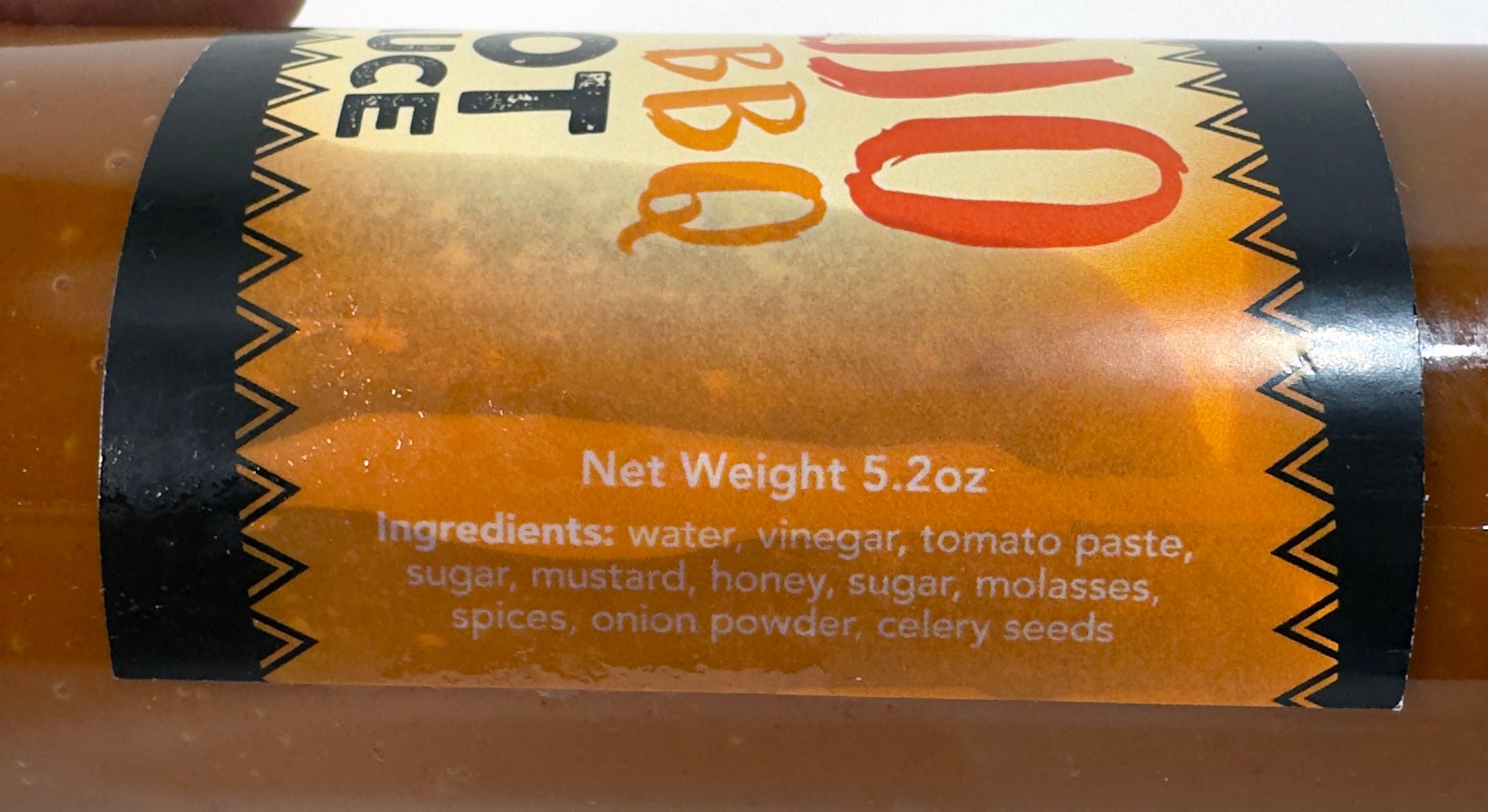 Mojo BBQ Hot Sauce ingredients label - water, vinegar, tomato paste, sugar, mustard, honey, molasses, spices - Purple Pepper Farms