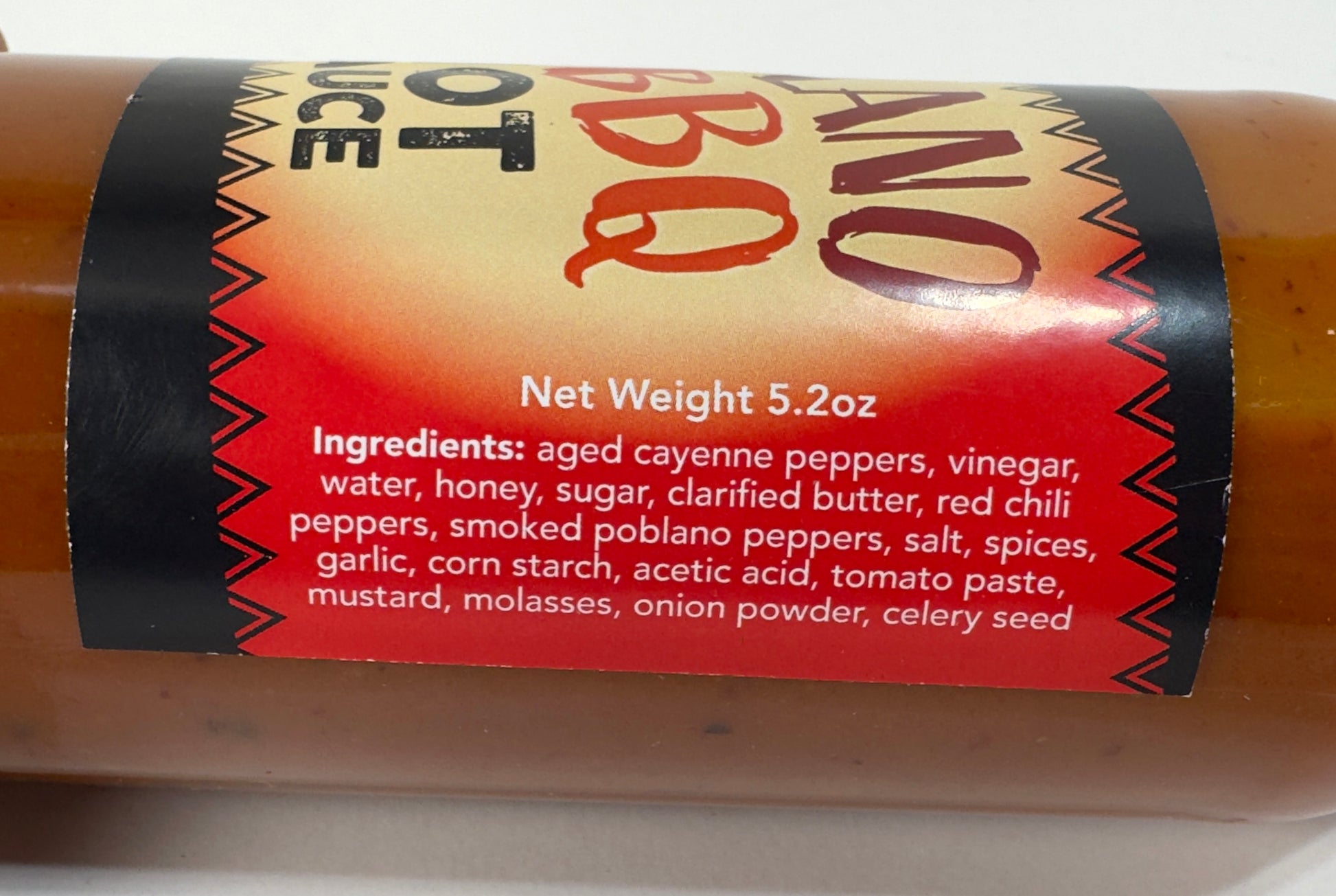 Poblano BBQ Hot Sauce ingredients label - aged cayenne peppers, vinegar, honey, smoked poblano peppers, butter - Purple Pepper Farms